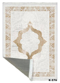 Washable beige and white area rug with floral border and intricate medallion pattern, corner flipped.