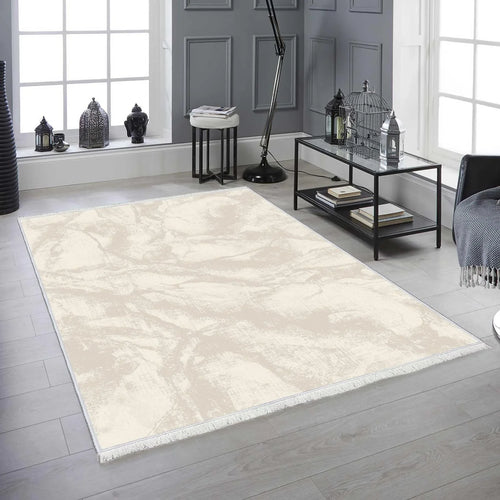 Modern beige and cream washable living room rug with subtle marble pattern, placed on light wood floor.