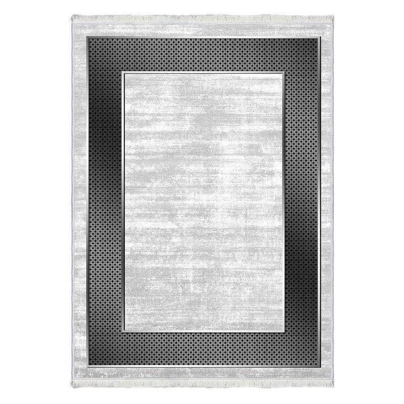 Modern washable rug with light gray center and black geometric border pattern