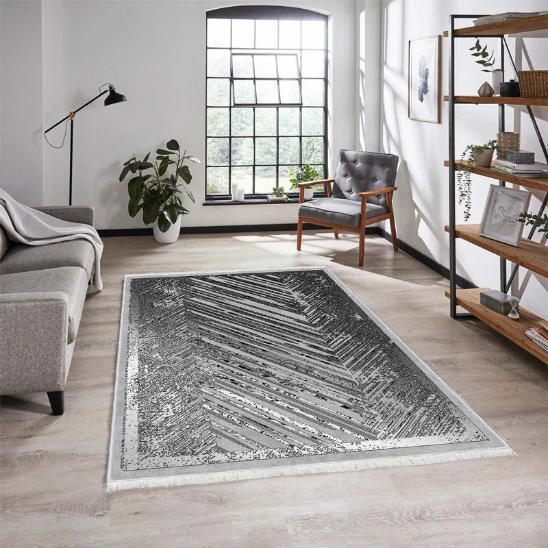 Modern washable rug with black and white geometric pattern in a bright living room
