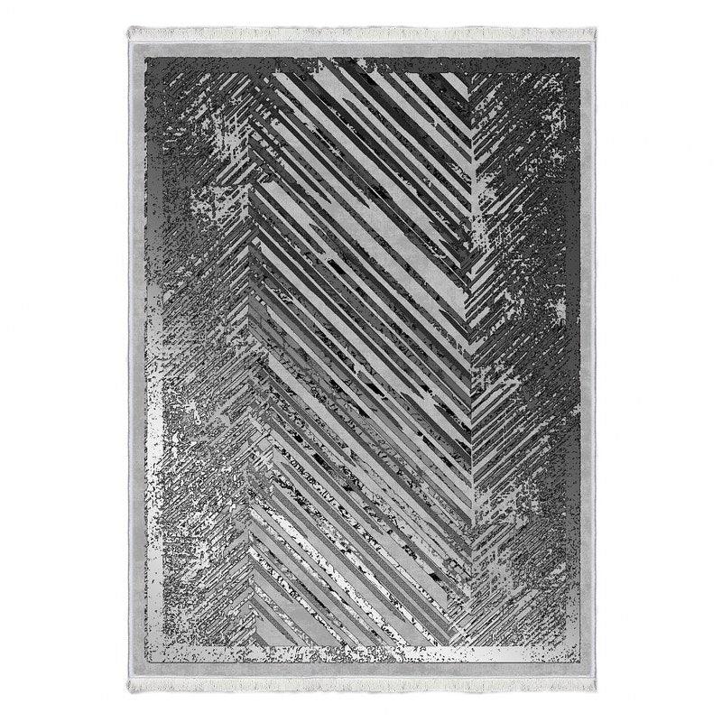 Modern washable rug with grey geometric chevron pattern and distressed texture
