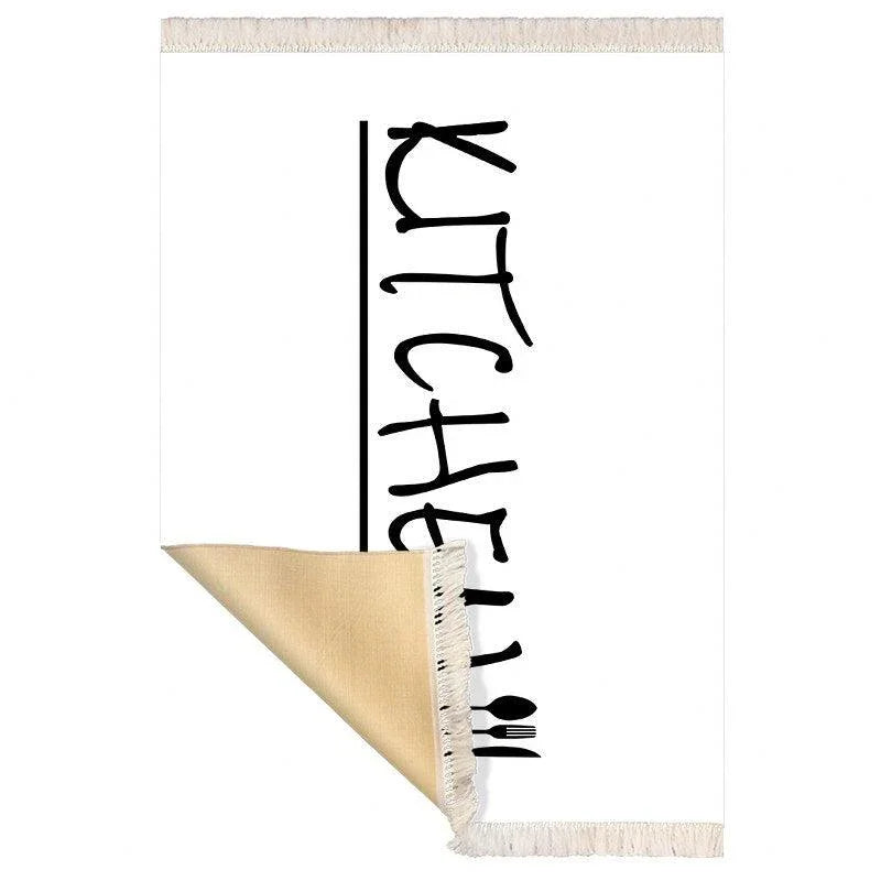 Waschbarer Küchenteppich mit „KITCHEN“-Schriftzug und Fransen, ideal für moderne Küchen
